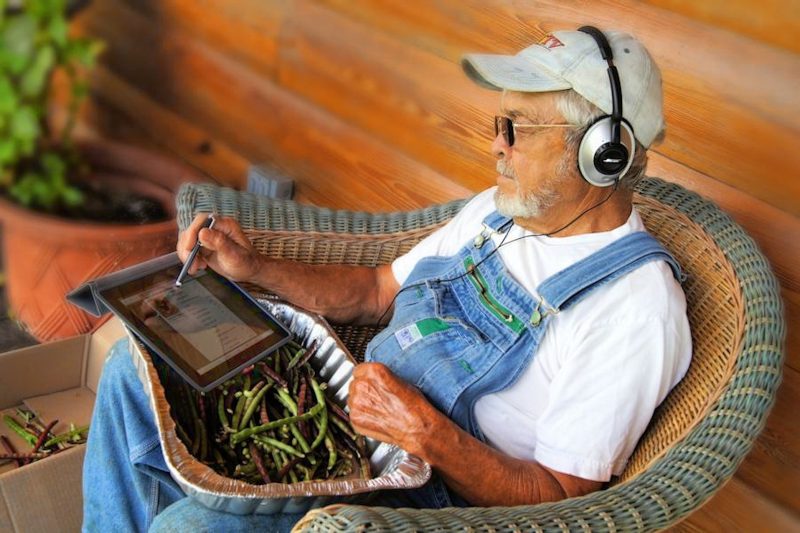 farmer looking up ppc services on ipad